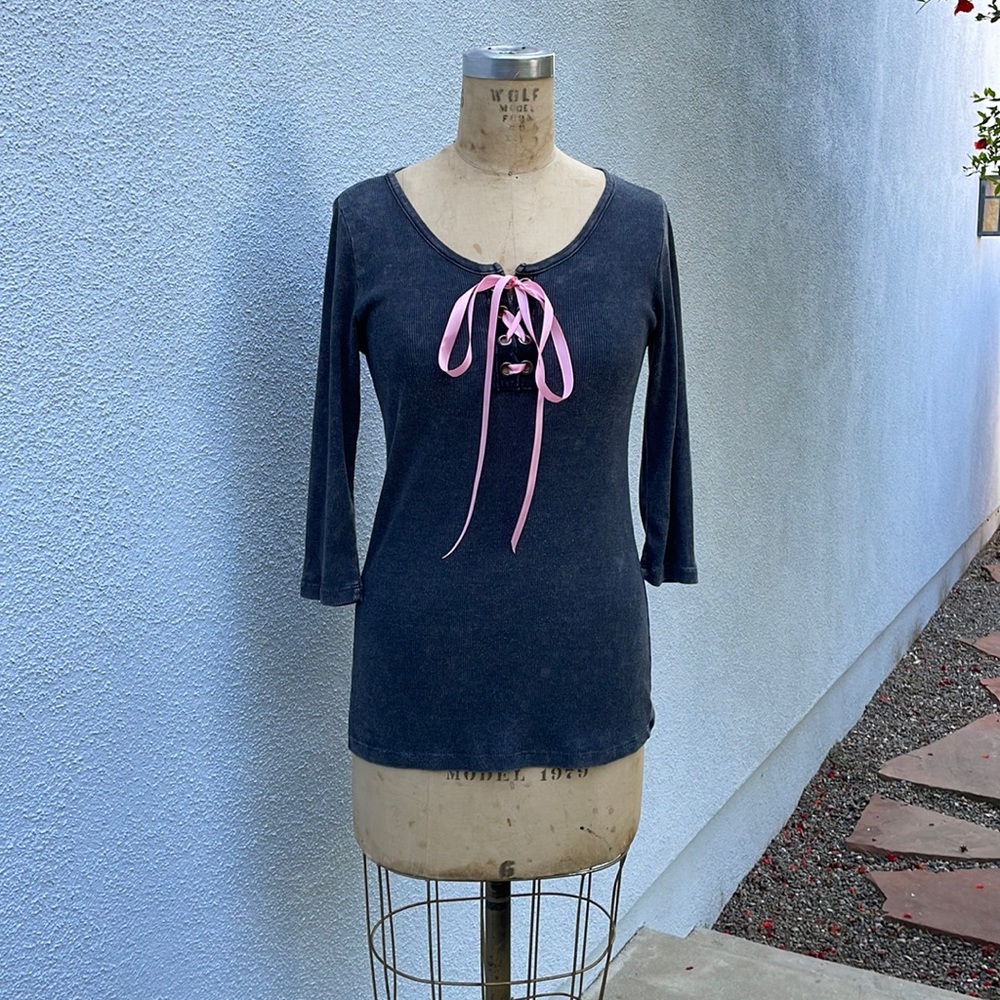 Soft and comfy 100% cotton tee with pink ribbon detail, longer length.
